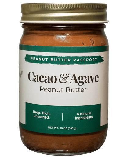 Jar of Cacao & Agave peanut butter with a gold lid on a transparent background