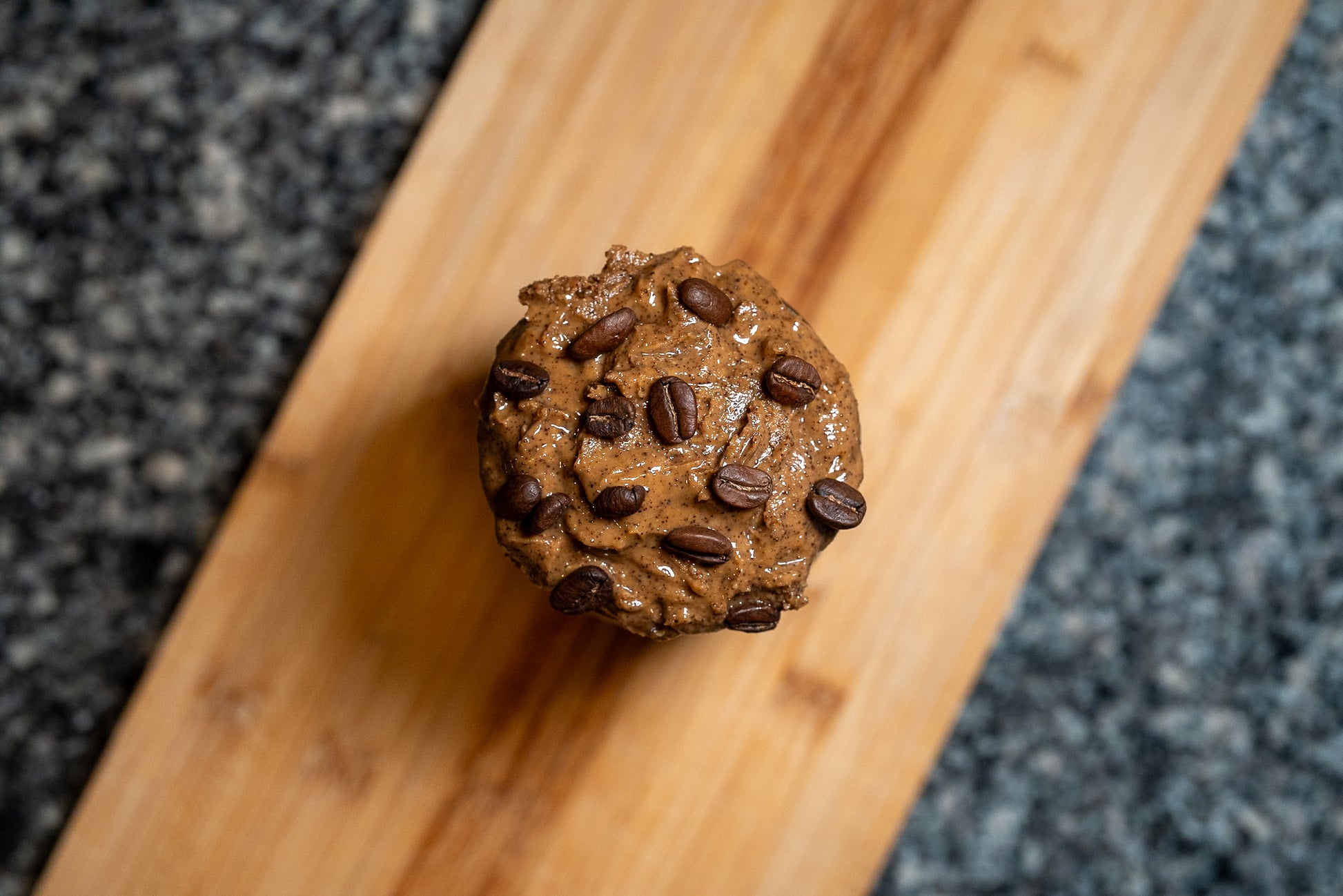 overhead photo of an opened jar of espresso peanut butter