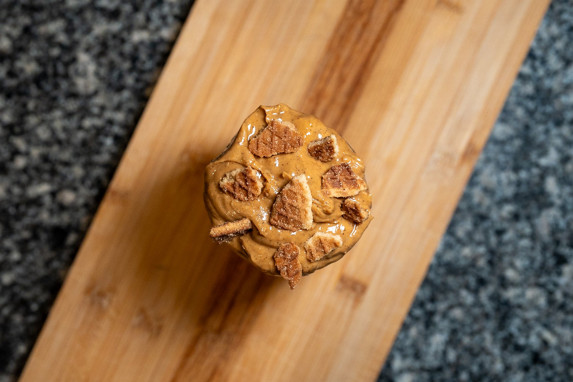 Overhead photo of stroopwafel peanut butter on wooden board